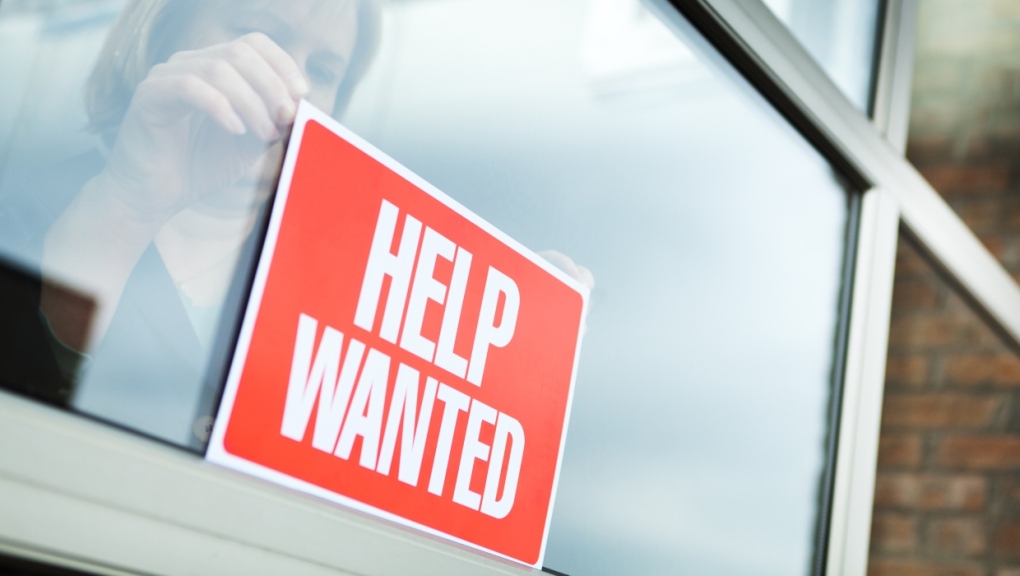 A "help wanted" sign is placed in a window. (Getty Images) 