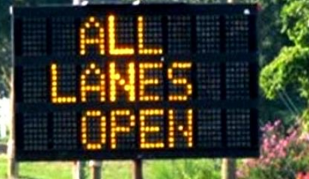 Electronic sign reading 'All lanes open.' (File photo)