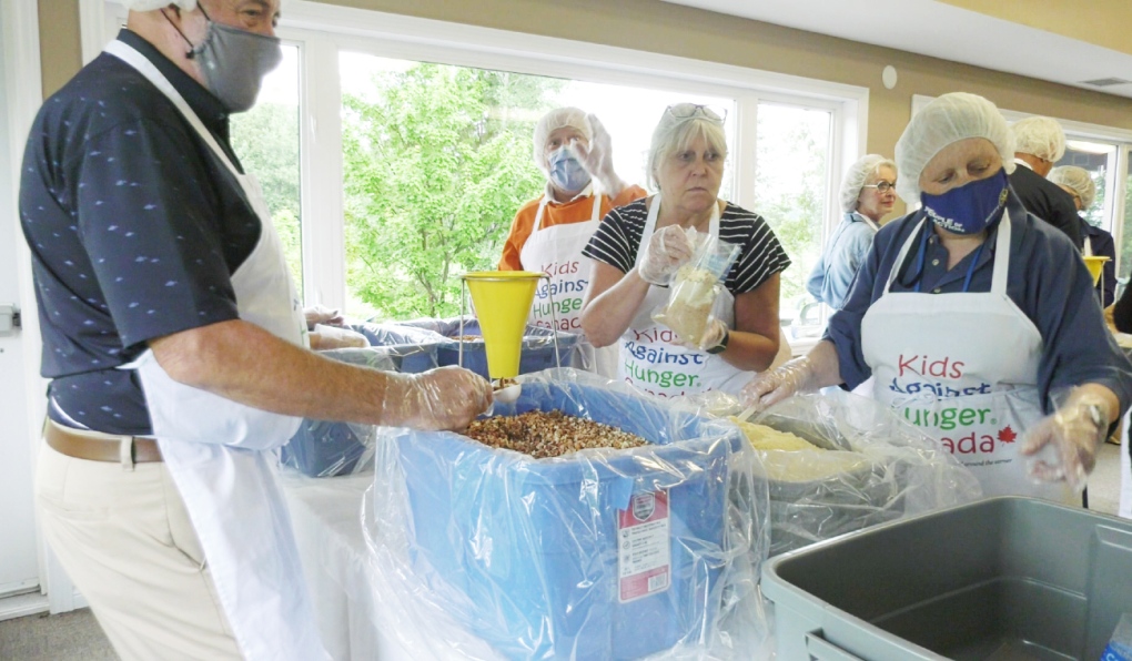 Members from the Rotary Club of North Bay spent Tuesday afternoon packaging thousands of meals that will be sent to First Nations communities in the north. (Jaime McKee/CTV News)