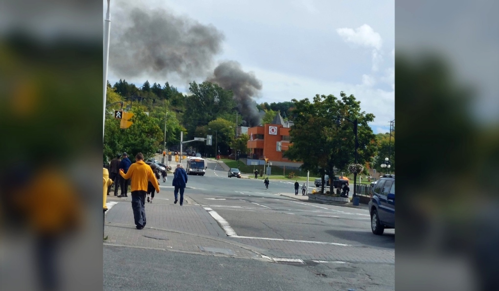 Lots of smoke could be seen in the distance in Sudbury’s downtown around noon as a campfire at a homeless encampment on Raphael Street near the top of the stair from Brady Street had gotten out of control. (Photo credit: Steve Young/Sudbury, Ont.)