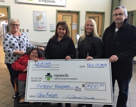 Domtar presents a cheque to support vein finders