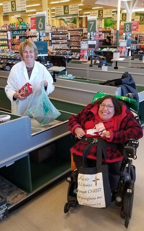Jolene and Carol Hughes bagging groceries