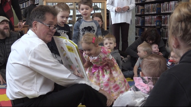 Timmins Mayor George Pirie reads to children