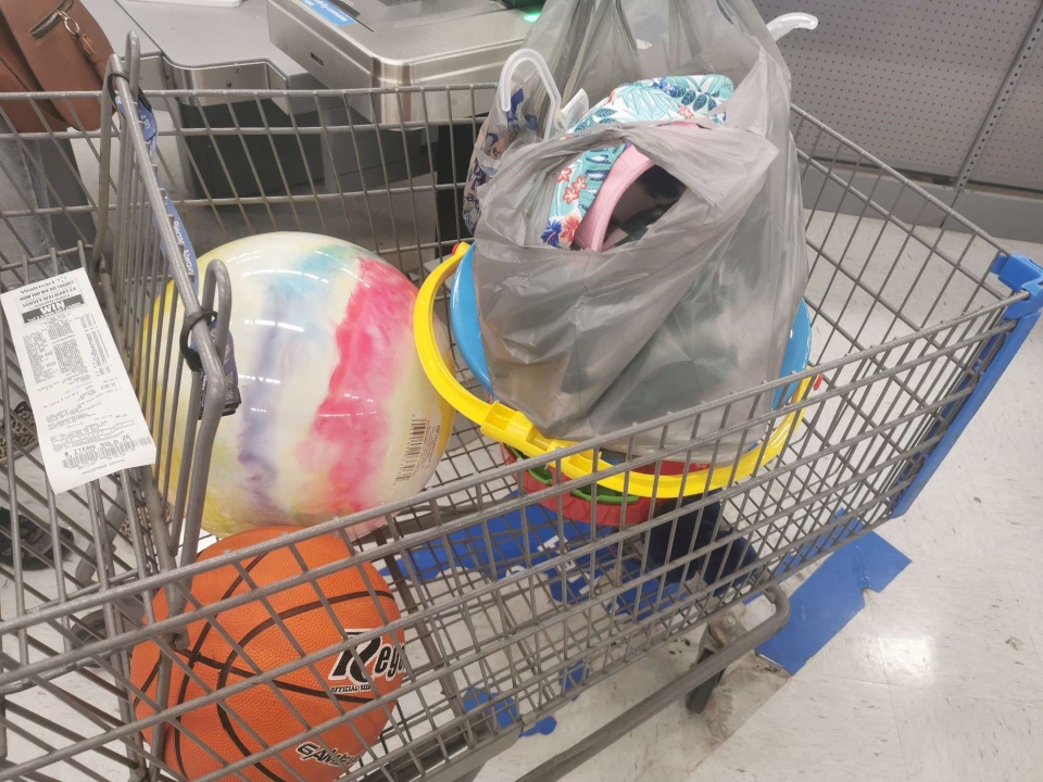 Shopping cart full of sporting goods at Walmart